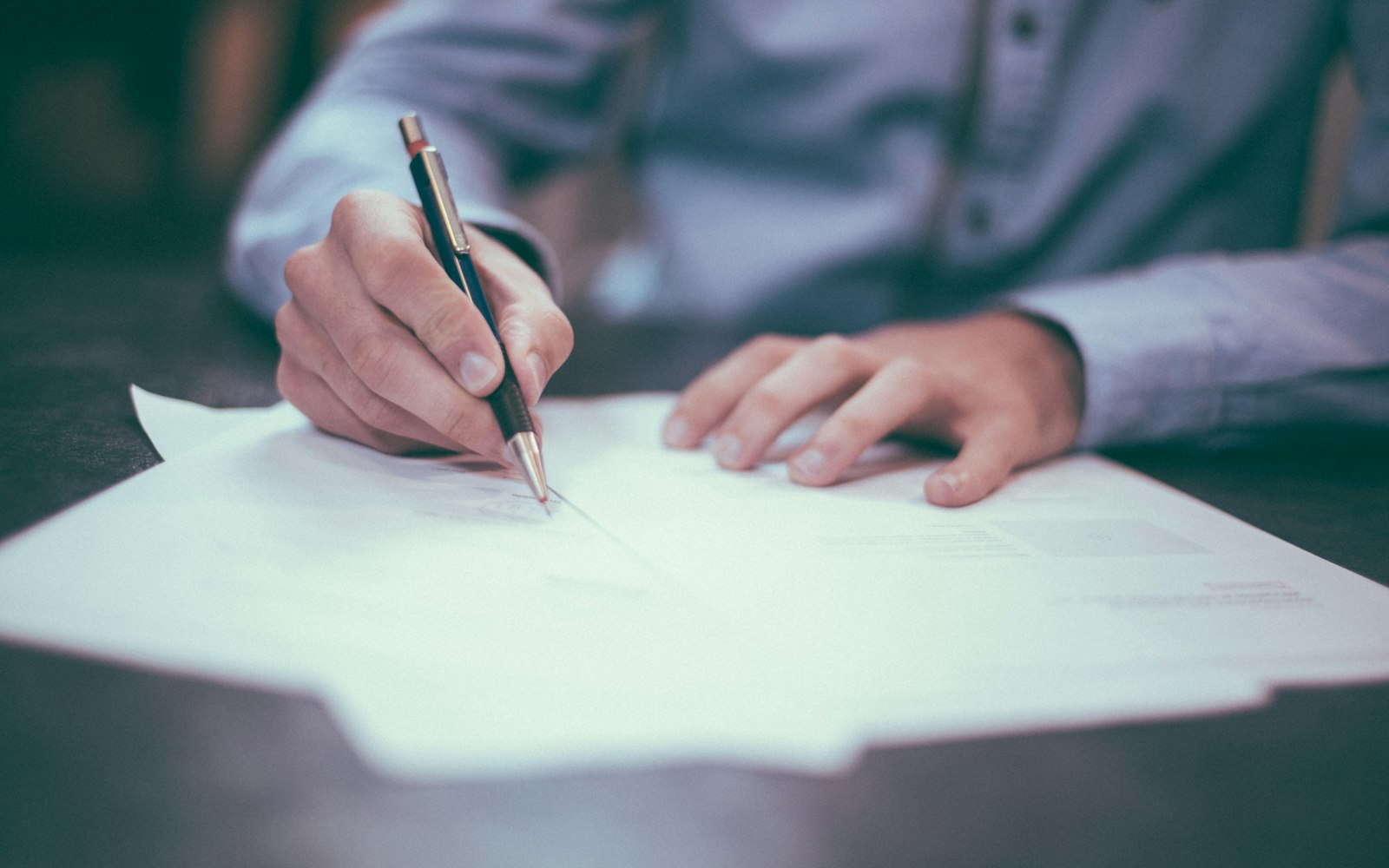 Hands reviewing a printed document