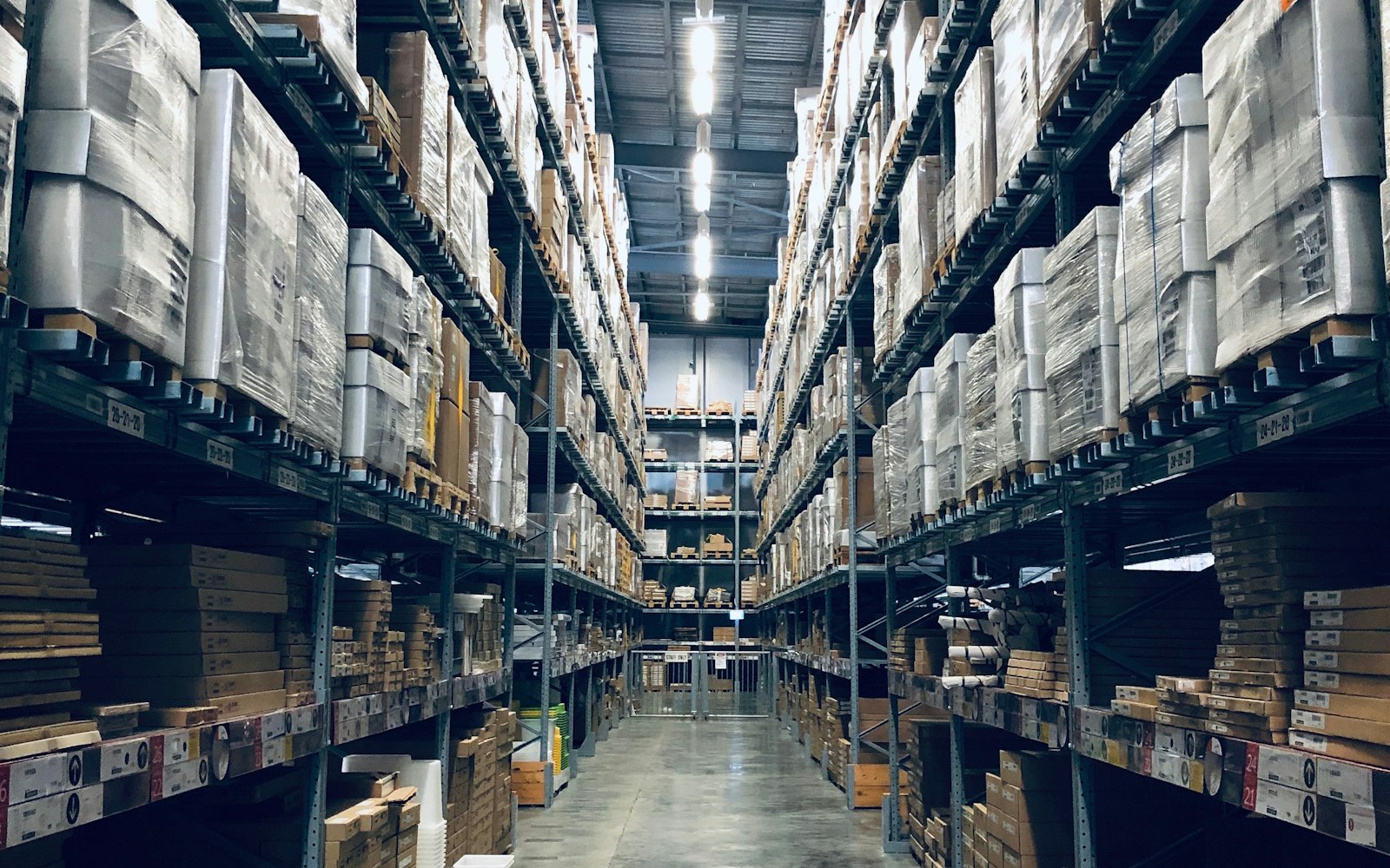 A warehouse aisle lined with pallet racking