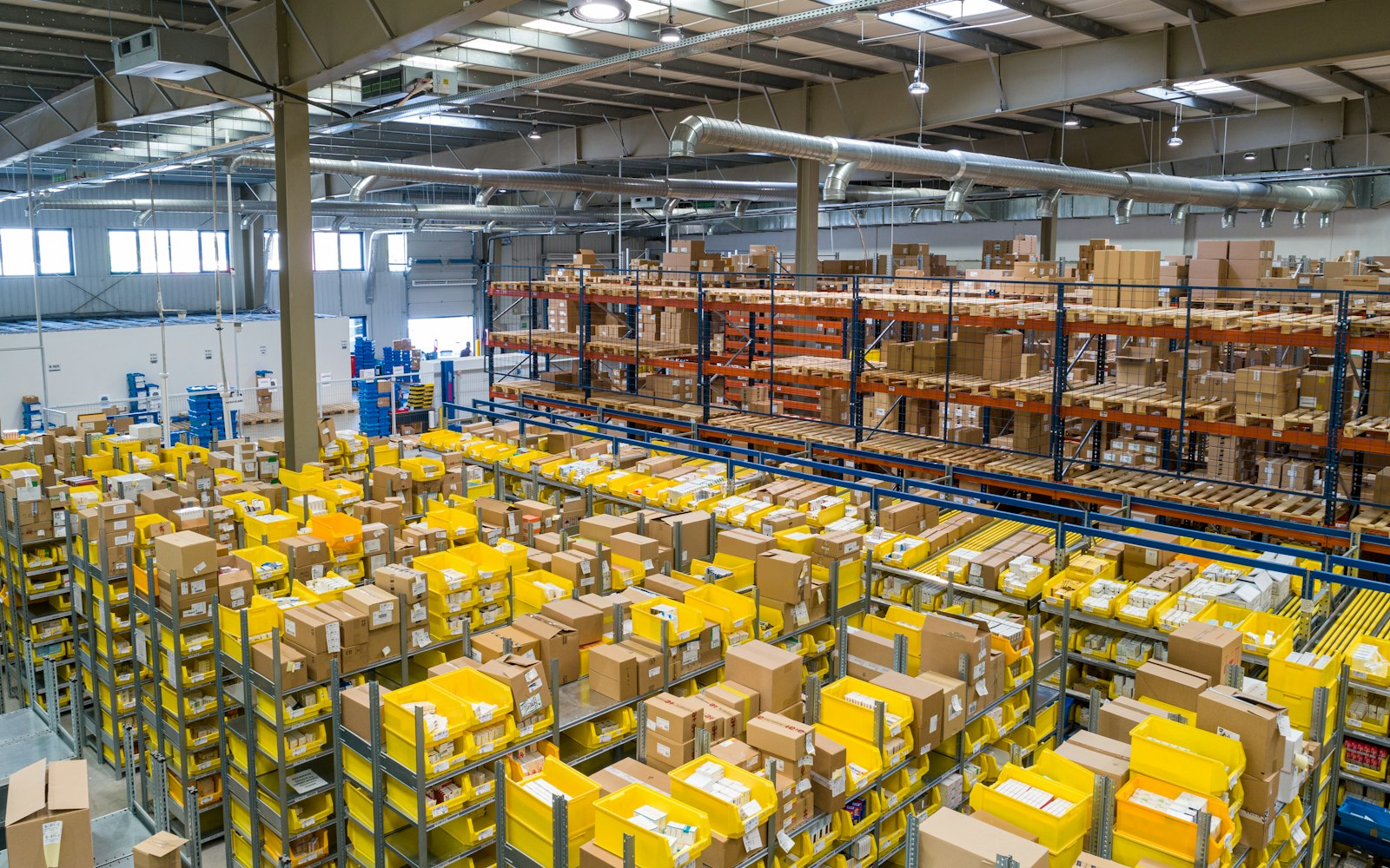 Labelled bins and boxes on warehouse racks